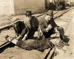 woman tied to train track