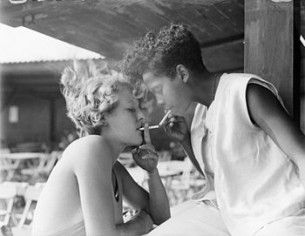 350px-Lighting_each_others_cigarettes,_1932