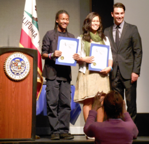 Ian Calderon posing with students